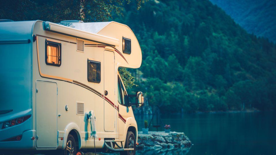 A campervan by a lake